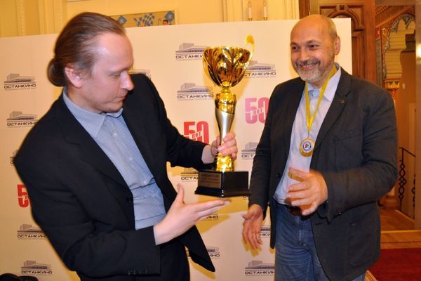 Alexander Spichkin (left) rewarding Dmitry Oleinikov